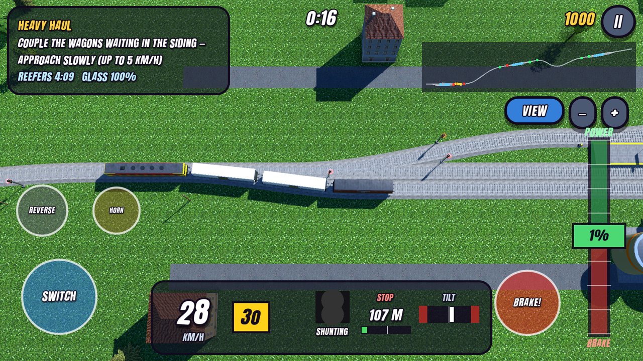 Top view of a locomotive approaching wagons in a siding