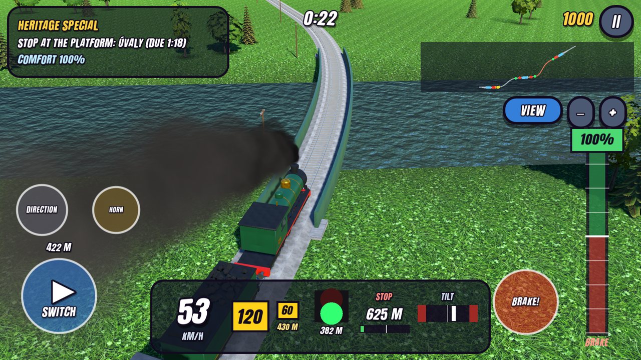 A green steam engine puffing black smoke along a river