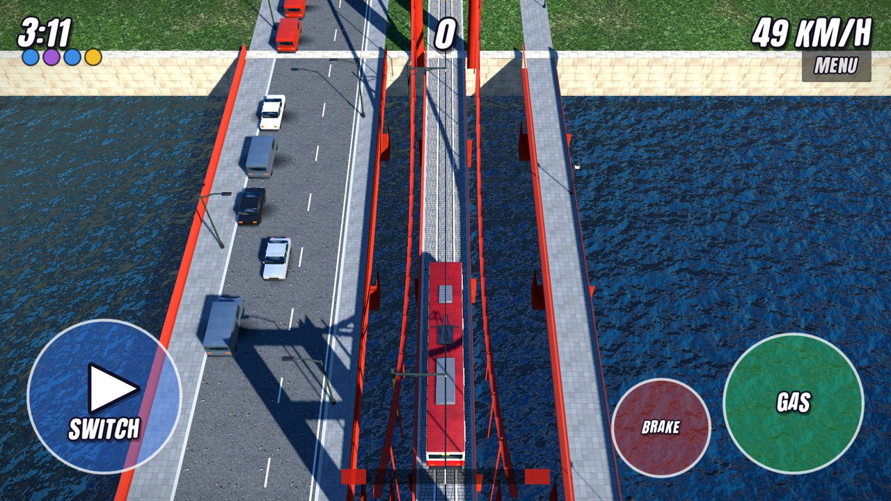 A tram crossing a red suspension bridge over the bay